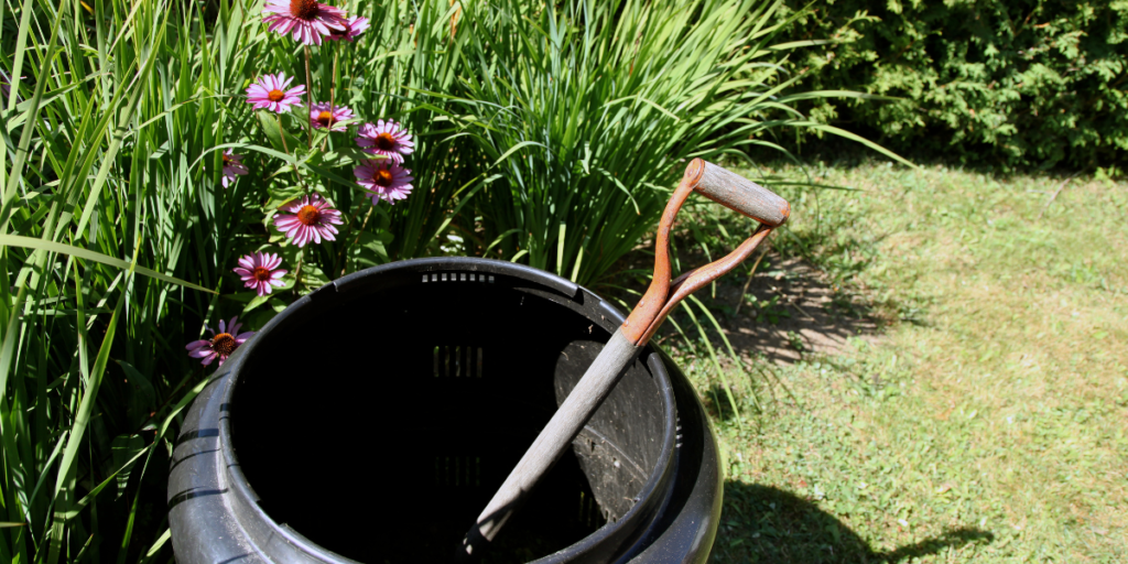 Backyard compost bin with green and brown composting materials